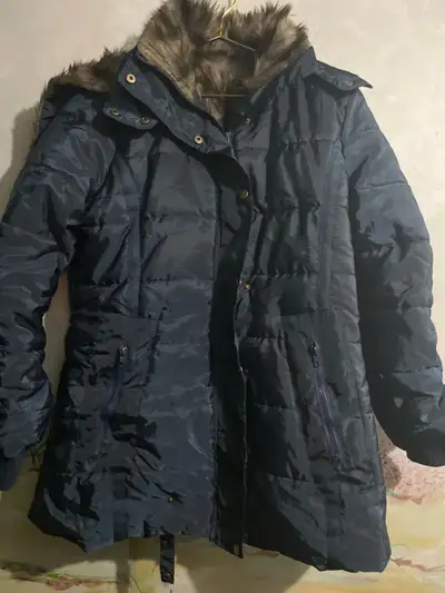 Stay warm and stylish with this blue women's winter coat, perfect for braving the Canadian cold! Thi...