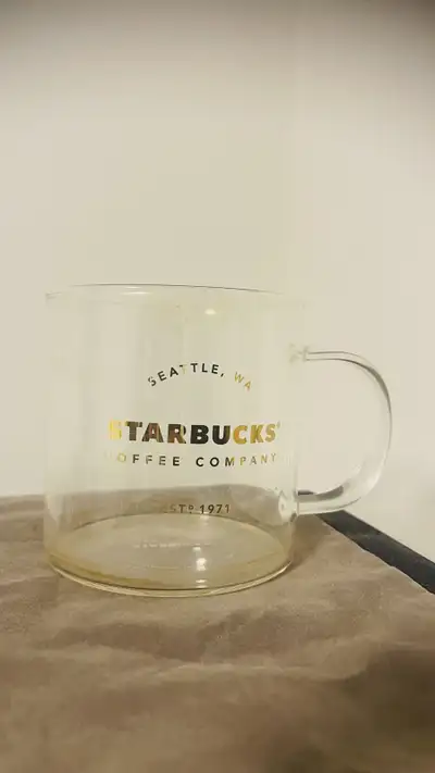 Starbucks glass mug in gold lettering, View more