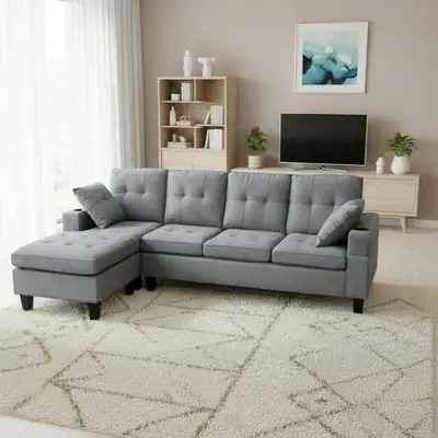 Upgrade your living space with this stylish and comfortable grey sectional sofa, featuring a chaise...