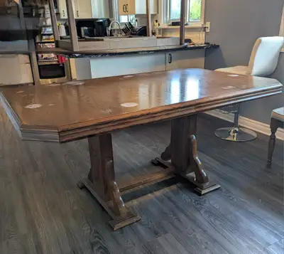 Dining room table with 6 chairs. Table top needs to be refinished but otherwise is in good shape. On...