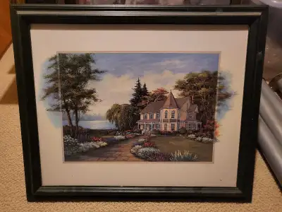 This is a used framed print featuring a picturesque house scene, complete with a charming garden and...