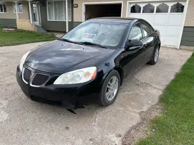 ‘05 Pontiac G6 for sale, 340,000 km, rusty, needs brakes and wheel alignment. Comes with winter tire...
