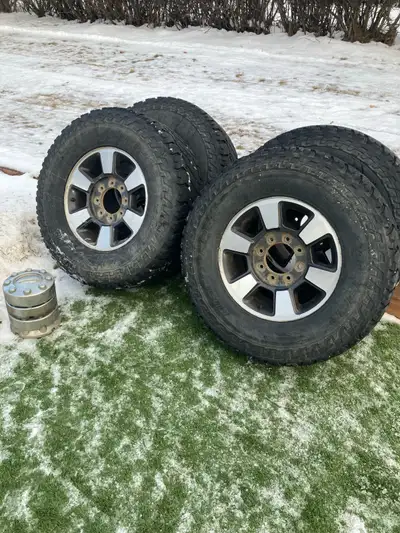 Ford F250/350 18 inch rims and tires, came off of a 2016 f350. 305/70R18” Comes with the center caps...