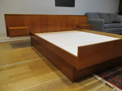 Made in Denmark, mid century modern queen bed frame with floating side tables was restored and now l...