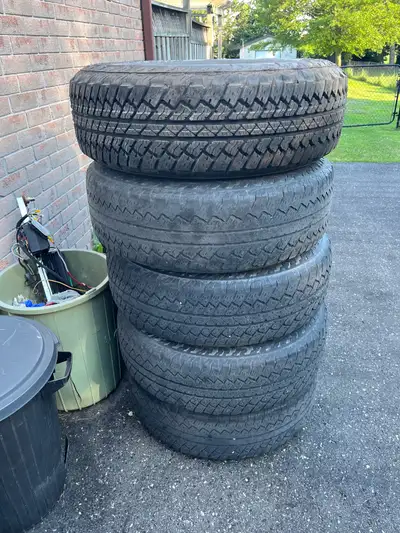 Good jeep 5 rims and tires Ready for summer or winter