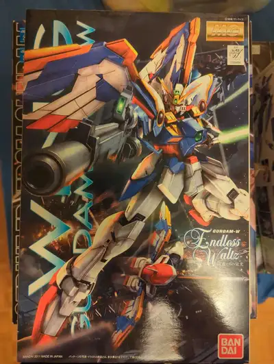 Up for grabs is a Bandai MG Wing Gundam EW model kit, partially assembled with care and precision. T...