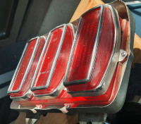 1969 mustang tail light. Original with housing and pig tail .