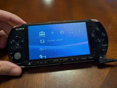 PSP 3000. NO BATTERY. Charge cable included, View more