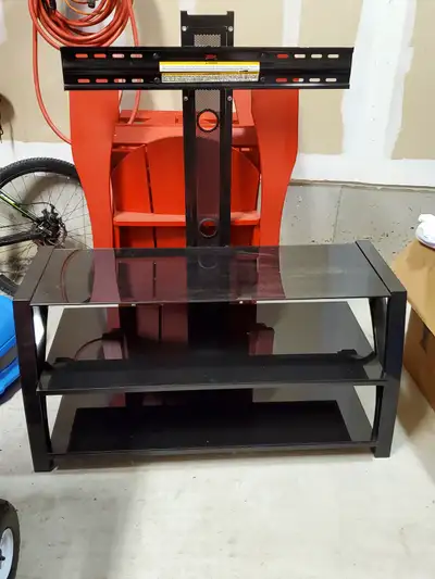 Tv stand with mount. Can hold up to a 65 inch tv. Willing to change price, feel free to throw out of...