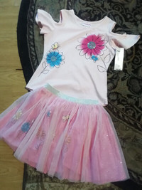 Girls pink shirt with a beautiful sparkly skirt...brand new