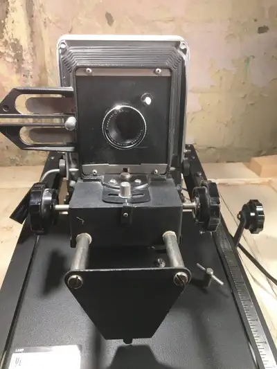 Beseler 23C II enlarger. The enlarger has no base plate. 1 Beseler #8055 35mm negative carrier. 1 Be...