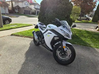 I'm selling my used white Kawasaki Ninja 300, a sporty and reliable motorcycle perfect for both begi...