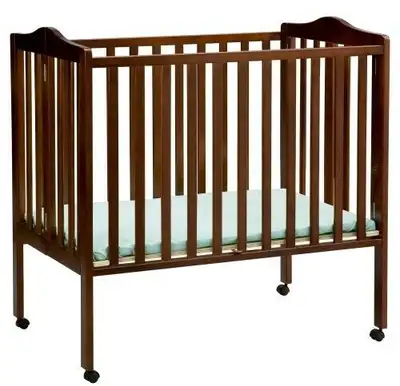 i have attached a photo of a Espresso color Wood Baby Crib It has locking wheels. No mattresss $80.0...