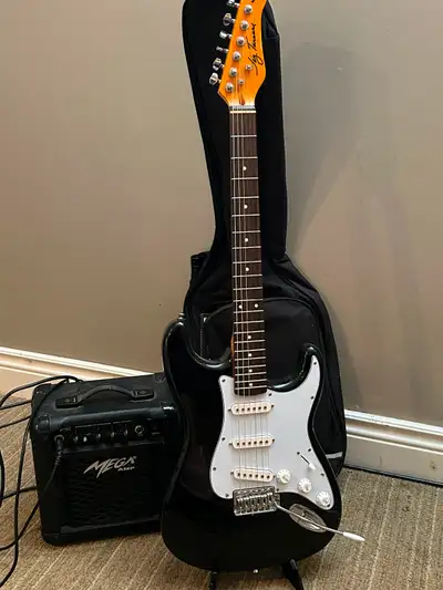 Electric guitar with amp, guitar stand, bag and music book