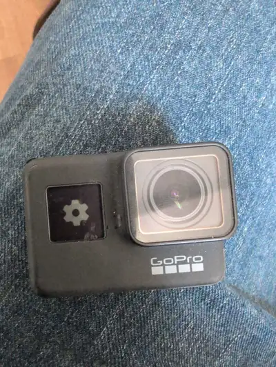 Selling a used GoPro Hero 7 Black with accessories. This action camera is known for its excellent 4K...