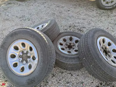 265/70/17 BFG long trail tires & wheels Factory GM wheels good tread left Slight weathering between...