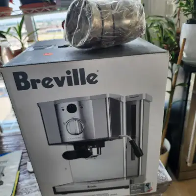 Little used espresso machine by Breville with accessories. Stainless espresso cups saucers plus stai...