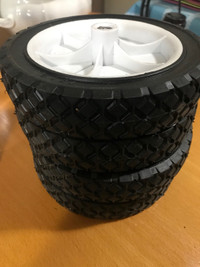4 pieces of  new, 7” plastic wheels 
