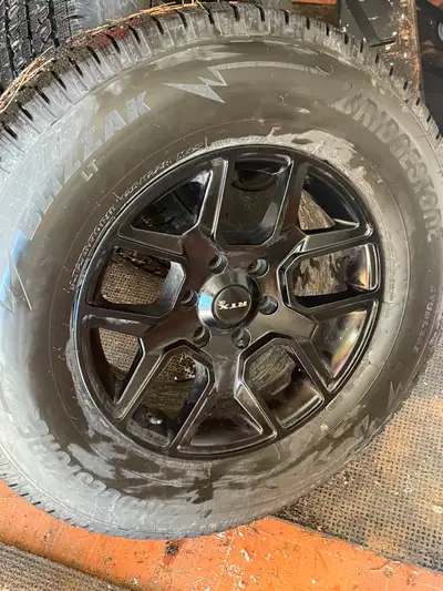 Less than 500Kms on these Blizzak tires and RTX rims. 6 bolt that fit late model Ram.. as well as GM...