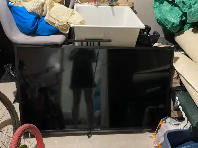 55 inch Hitachi with remote must be mounted good for garage or cottage . Pick up in Barhaven.