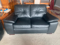 Black leather love seat