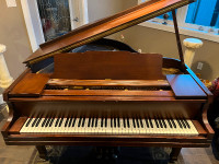 Beautiful brown  grand piano only $3000 delivery included