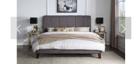 Dark grey upholstered queen size bed