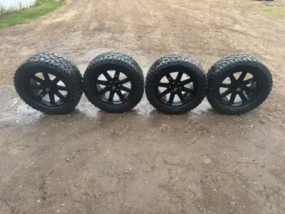 Basically brand new set of wrangler duratracs 33 x 12.5 mounted on Satin Black GTA Invasion Rims. 20...