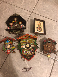 Set of 5 miniature winding cuckoo clocks.