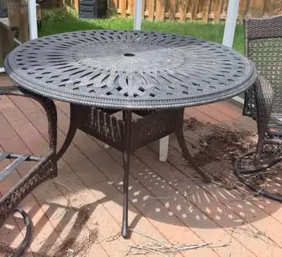 Beautiful cast aluminum outdoor dining table in antique bronze finish. This is a heavy-duty, rust-re...