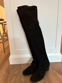 Black suede thigh high boots by Stuart Weitzman