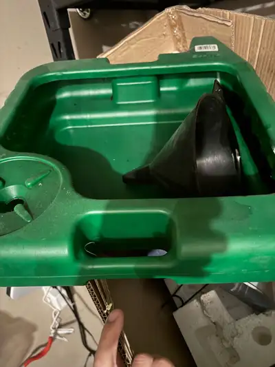 I'm selling a green oil drain pan with a funnel, perfect for DIY oil changes. This pan is used, but...