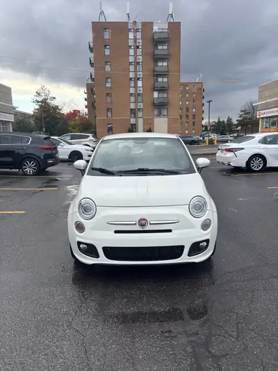 This stylish, used, white Fiat 500 offers a unique driving experience with its compact size and dist...