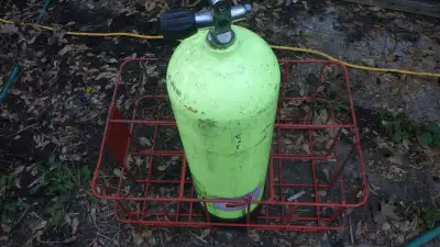 Scuba tank rack holds upto six 80 cf tanks. Tank not included.