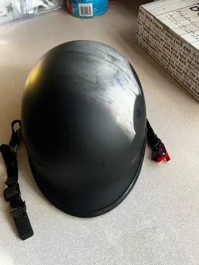 This black WCL DOT FMVSS No.218 certified motorcycle helmet is perfect for ensuring safety while rid...