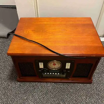 Victrola brand, 6-in-1. Needs repair for the needle/cartridge, otherwise the platter spins normally....