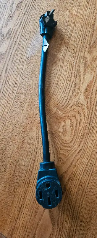 30A male to 50A Female RV Adapter Plug Used in excellent condition Total length 20"