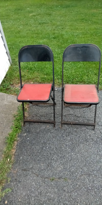 Two vintage steel folding chairs