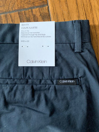Calvin Klein mens pants, slim fit, 33x32, brand new tags att.