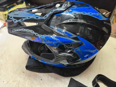 This ILM adult dirt bike helmet, sporting a cool blue and black design with included goggles, is in...
