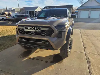 All the bells and whistles. Basically brand new. Dream drive. TRD Pro air ride front seats.