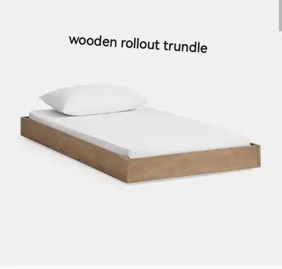 This wooden rollout trundle is in used condition and ready to provide extra sleeping space! Ideal fo...