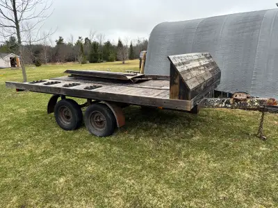 Tandem trailer made from an old travel trailer. The deck is 8x14. It’s high off the ground because I...