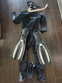 Woman’s wet suit, snorkel, mask, booties and fins