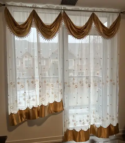 Selling a set of beautiful gold and white floral window curtains. They're in great condition and wou...