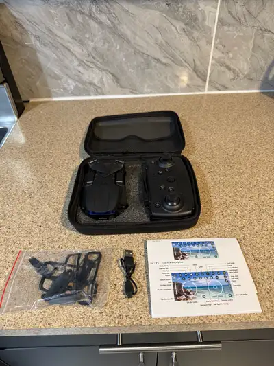 Selling a gently used RC FPV drone. It comes with its original case, a remote control, extra propell...
