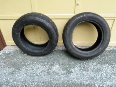 Two used Tiger Paw AS65 tires. Size= 215/65R17 99T M&S Tread depth new =11/32 they have 9\32 tread r...