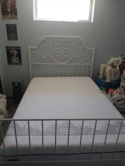 The frame is an Ikea Leirvik brand metal bed frame with slates. Only lightly used. The mattress is a...
