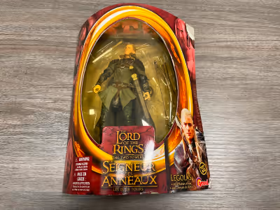 Legolas figure in box with all accessories and 2 packs of Reel Coinz with unused stickers. $10 for l...