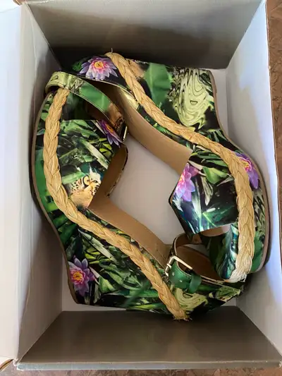 Add a touch of wild elegance to your step with these Geox wedge sandals in a women's size 40 US size...